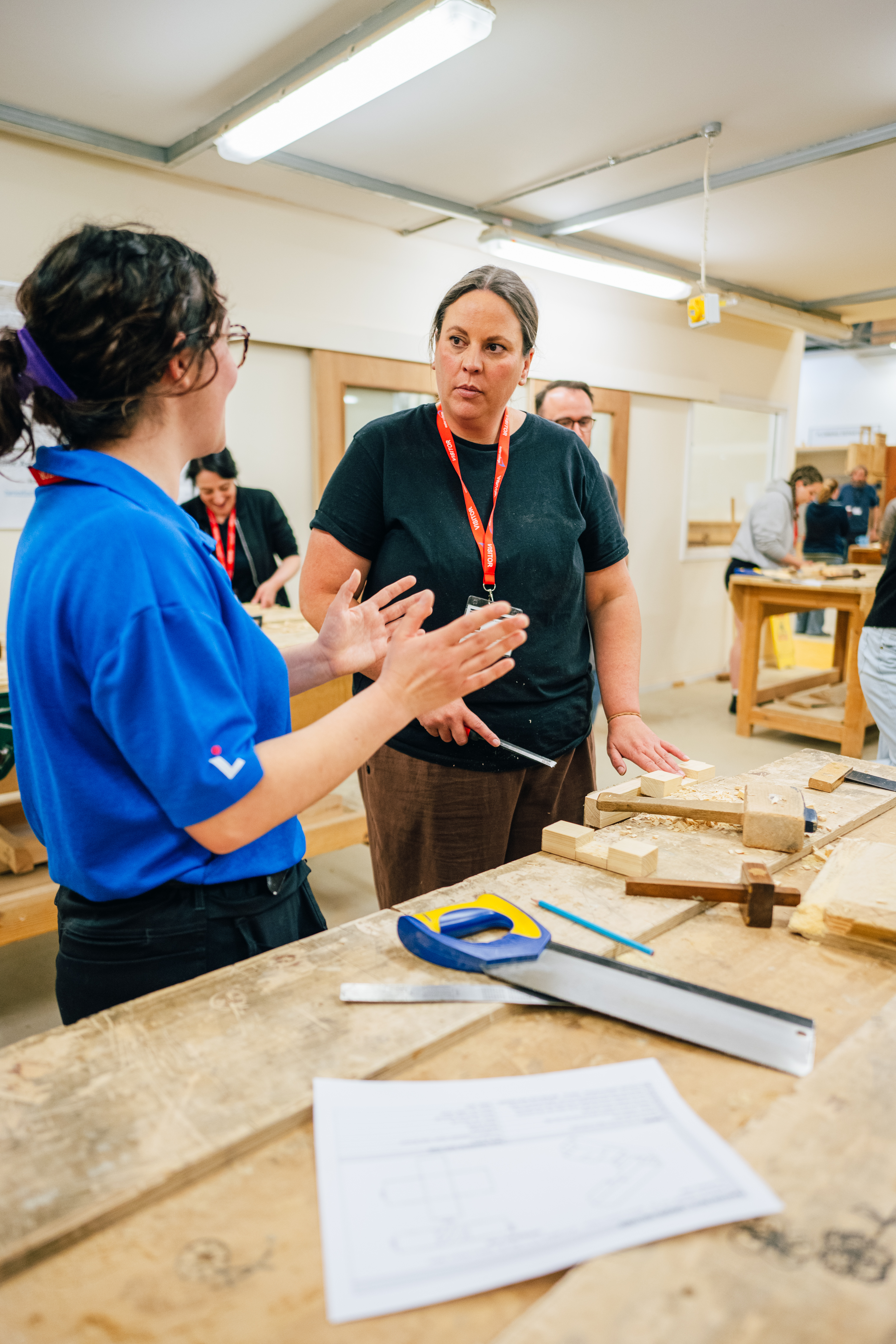 Two female colleagues learning a trade at our Women in Trades workshop