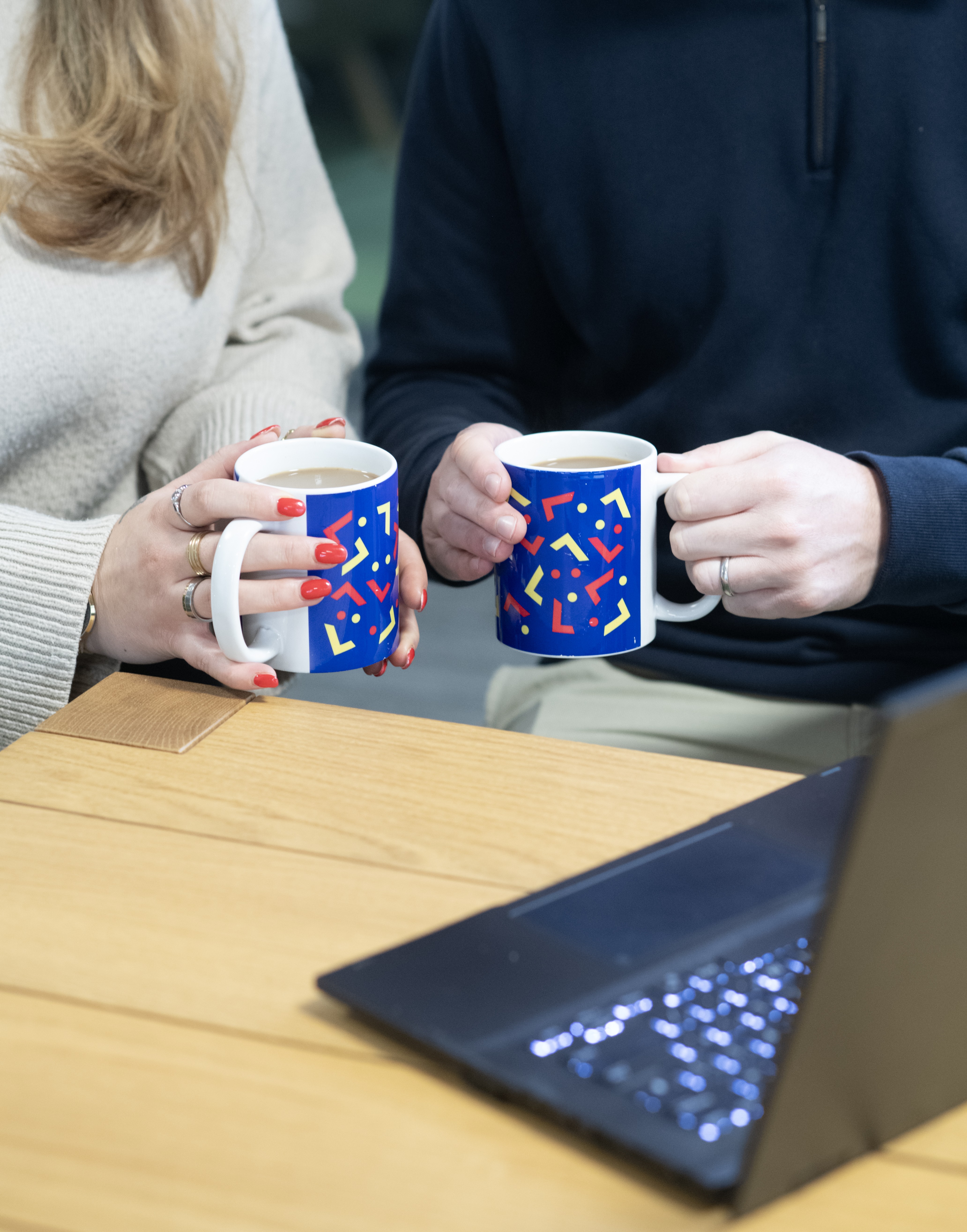 hands with mugs tall
