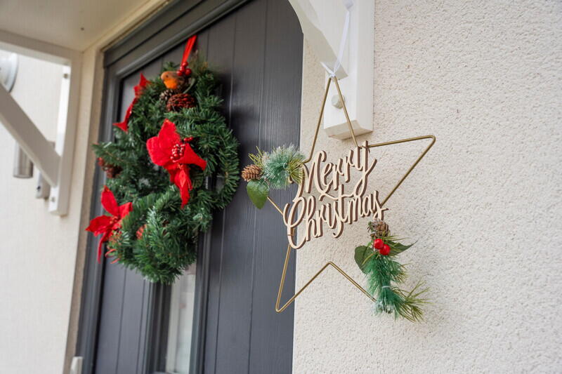 Festive wreath and 'Merry Christmas' sign outside a LiveWest' home.