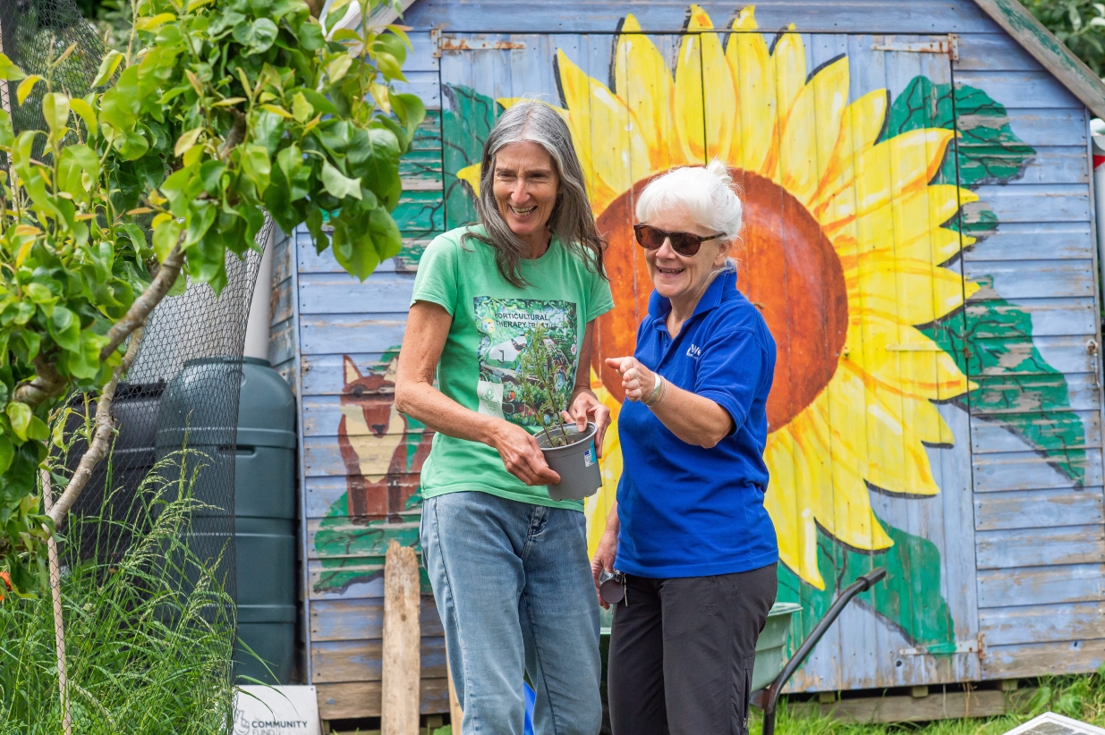 Deb and Mai talking at the allotment 