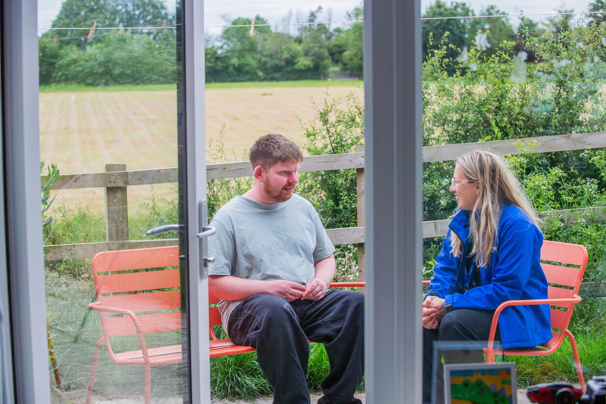 A LiveWest customer at a learning disability support scheme with a colleague. 