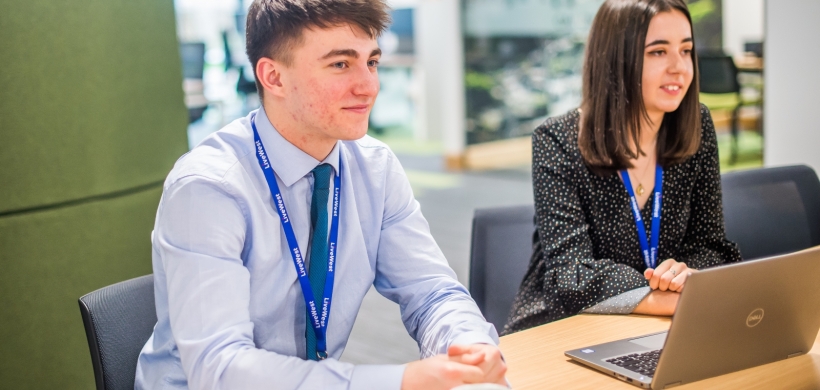 Two apprentices smiling 