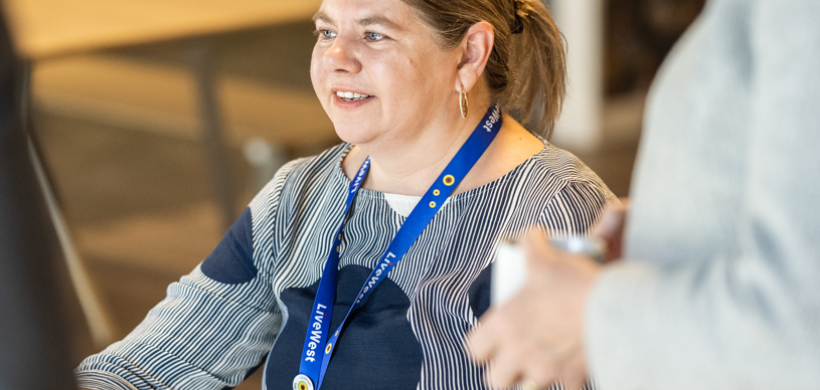 LiveWest colleague in a blue sunflower lanyard