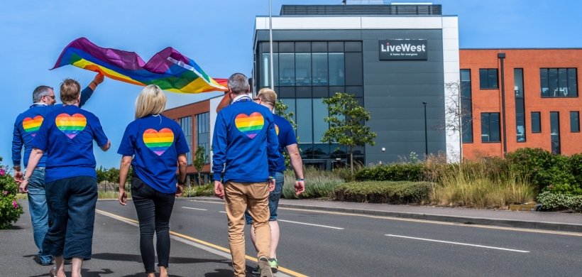 LiveWest colleagues with a Pride flag at our Exeter office