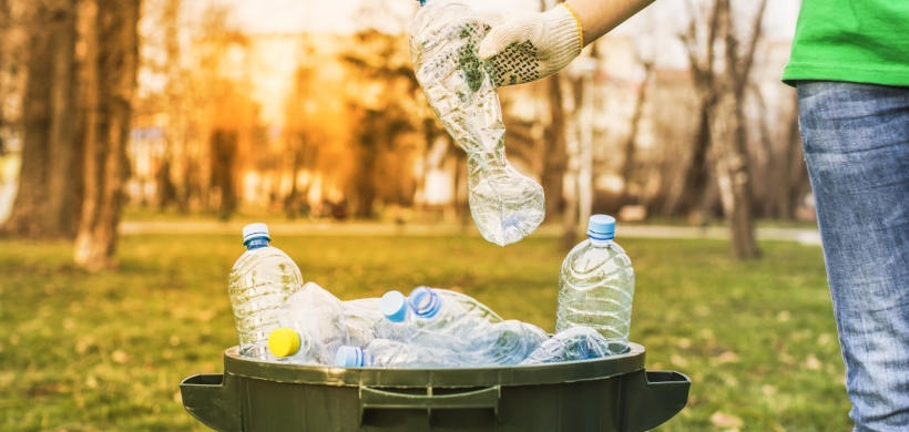 A person recycling plastic bottles. Photo: Shutterstock/HSSstudio
