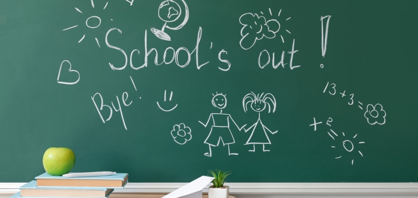 School chalk board with 'school's out' written on