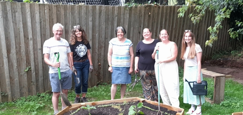 A group of volunteers in the new community garden.