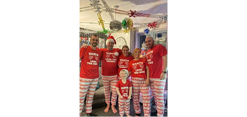 Jayne and her family in matching Christmas pyjamas. 