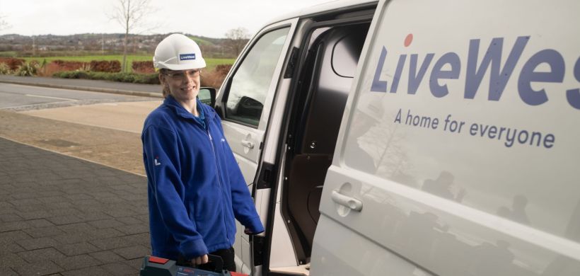 Charlie Hardy taking a tool box out of a LiveWest van.