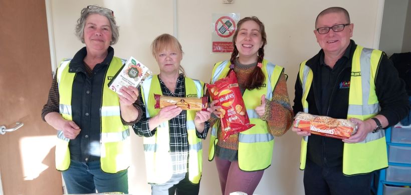 The volunteers with some of the food available at the larder. Image: LiveWest