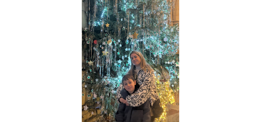 Cara and Zachary in front of the Christmas tree