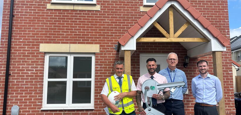 Representatives from LiveWest and Persimmon Homes marking the handover of 35 affordable homes at Haywood Village in Weston-super-Mare.