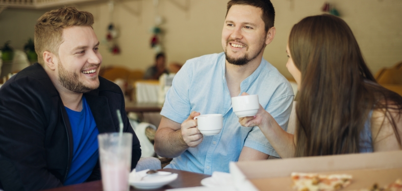 people smiling and chatting