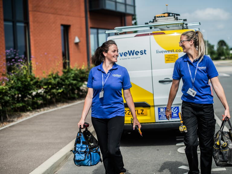 two tradeswomen walking