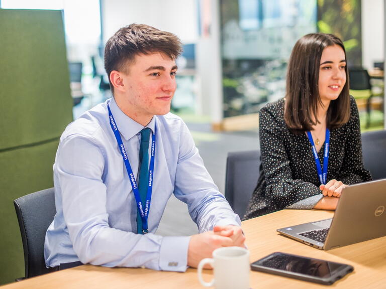 Two apprentices smiling 