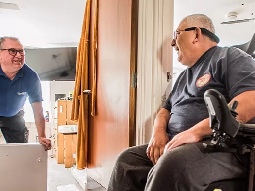 Customer in a wheelchair talking to a LiveWest colleague