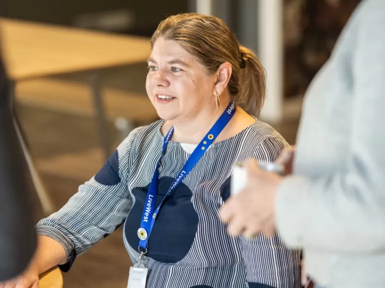 LiveWest colleague in a blue sunflower lanyard
