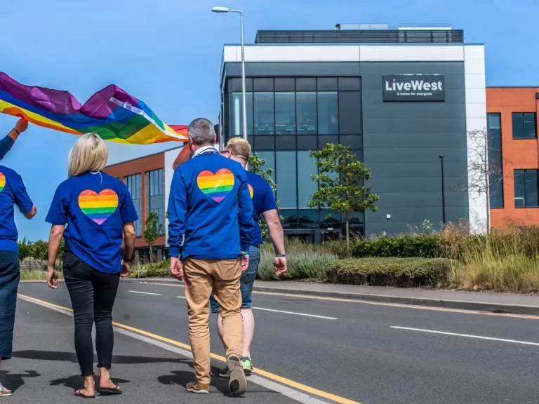 LiveWest colleagues with a Pride flag at our Exeter office