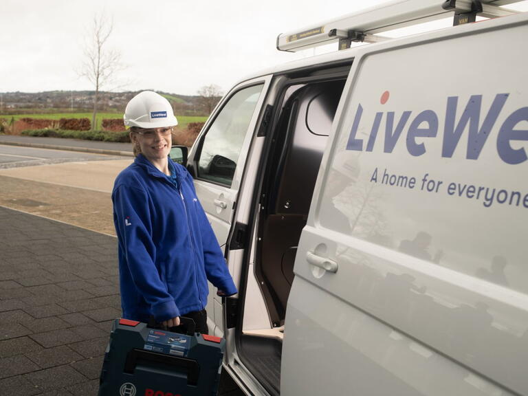Charlie Hardy taking a tool box out of a LiveWest van.
