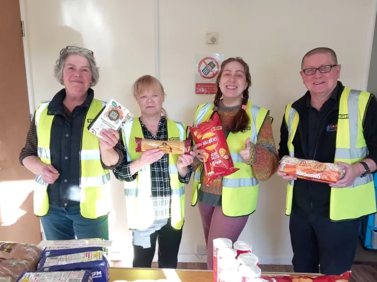 The volunteers with some of the food available at the larder. Image: LiveWest