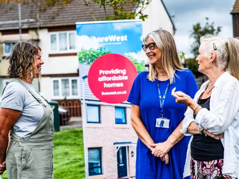 Customers chatting outside a LiveWest home