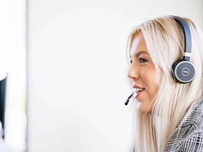 Image of a LiveWest colleague speaking to someone on a headset.
