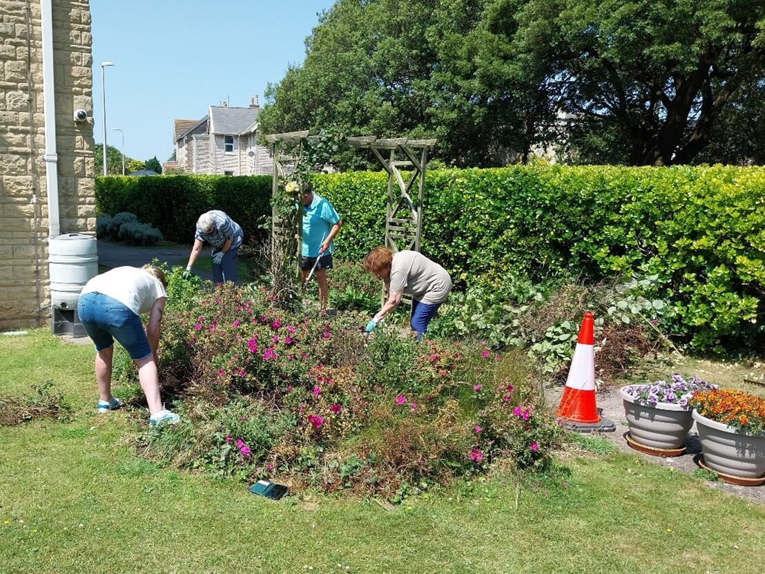 Image of residents gardening in the Plumley Court garden