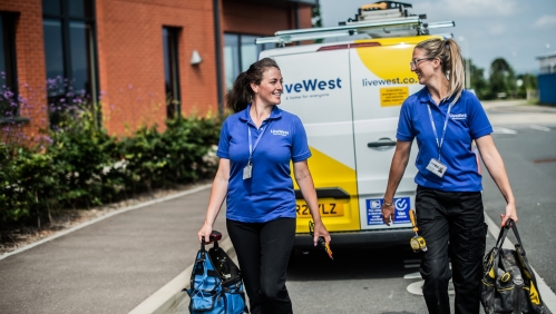 two tradeswomen walking