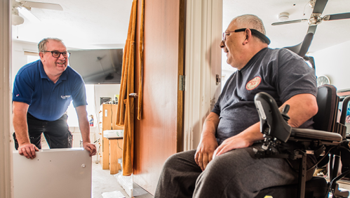 Customer in a wheelchair talking to a LiveWest colleague