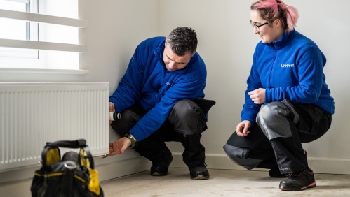 LiveWest colleagues carrying out a repair on a radiator. 