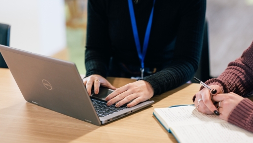 A LiveWest colleague using a laptop. 