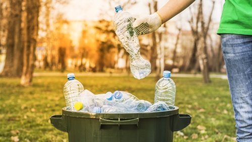 A person recycling plastic bottles. Photo: Shutterstock/HSSstudio