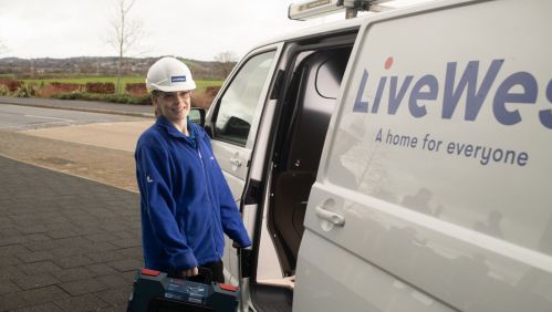 Charlie Hardy taking a tool box out of a LiveWest van.