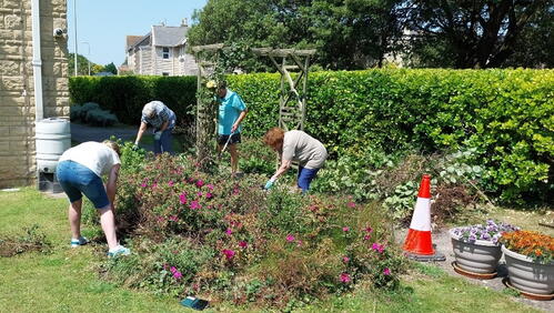 Image of residents gardening in the Plumley Court garden