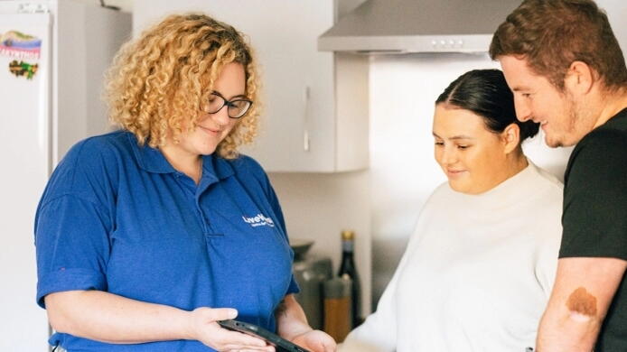 LiveWest employe with customers