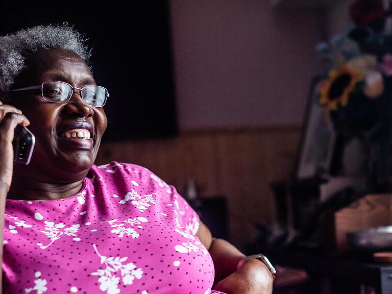 A LiveWest customer speaking on the phone.